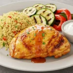 Harissa Honey Chicken Your New Favorite Flavor-Packet Recipe 17 Delicious Harissa Honey Chicken served with couscous, grilled vegetables, and yogurt sauce.