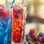 Italian Soda Recipe: Easy, Fizzy, and Flavorful 23 Two vibrant Italian soda recipe in tall glasses with berries, ice, and colorful straws.