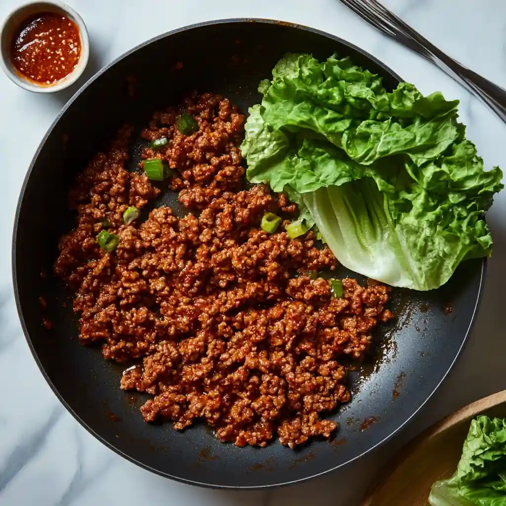 Healthy Korean Ground Beef Lettuce Wraps in 20 Minutes 3 Step-by-step preparation of Korean Ground Beef Lettuce Wraps in a bright home kitchen.