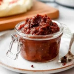 Hello Fresh Tex Mex Paste 11 Sealed glass jar filled with Hello Fresh Tex Mex paste on a ceramic plate