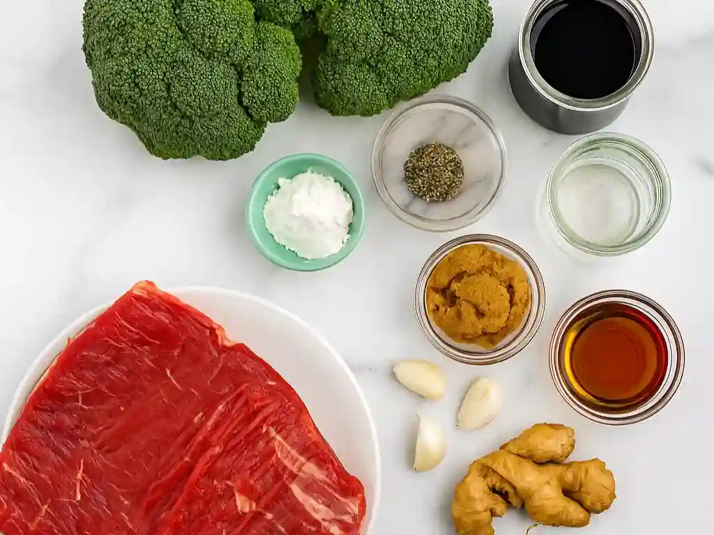 The Best Beef and Broccoli Recipe in One Pan 3 Raw beef, broccoli, garlic, ginger, and stir-fry sauce ingredients for beef and broccoli