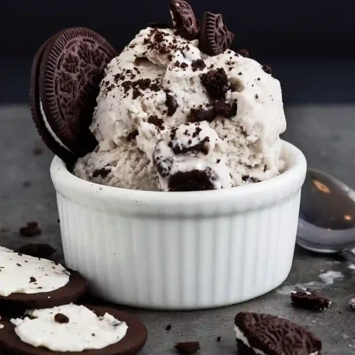 Cookies and Cream Ice Cream Recipe 7 Scoop of Cookies and Cream Ice Cream topped with cookie crumbles in a white ramekin