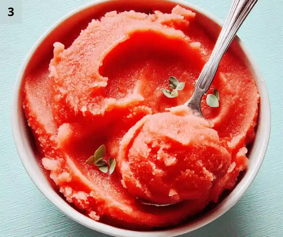 5-Minute Watermelon Sorbet 4 Spoon scooping smooth watermelon sorbet from a bowl