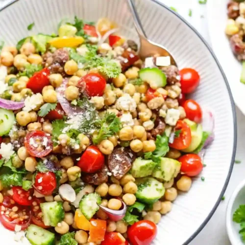 Easy Mediterranean Chickpea Salad Recipe Fresh and Quick 6 Close-up of Mediterranean chickpea salad with cucumbers, tomatoes, olives, and parsley