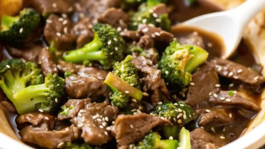 The Best Takeout-Style Chinese Beef and Broccoli Stir Fry 1 Chinese beef and broccoli with tender beef, fresh broccoli, and sesame seeds in glossy brown sauce