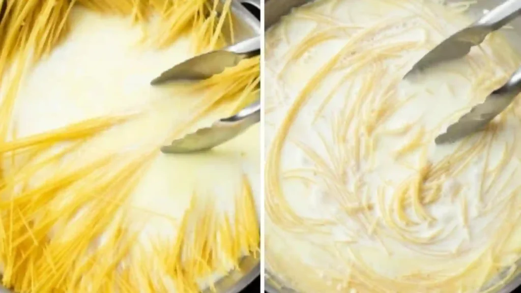 One-Pot Garlic Parmesan Pasta Recipe 4 tongs stirring pasta in creamy garlic parmesan pasta base