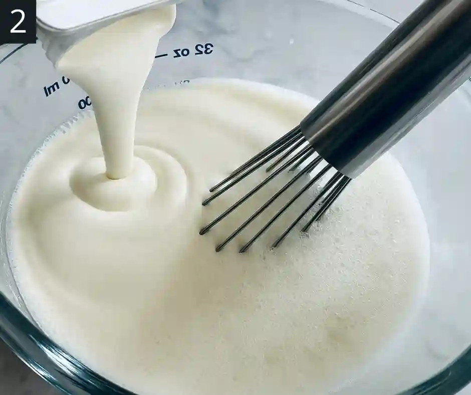 Cookies and Cream Ice Cream Recipe 3 Pouring heavy cream into bowl with milk mixture for Cookies and Cream Ice Cream