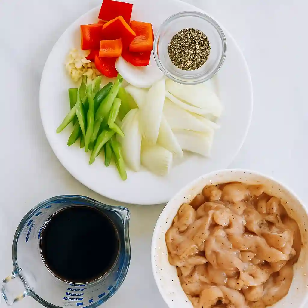 Black Pepper Chicken Recipe 2 Ingredients for Black Pepper Chicken including marinated chicken, bell peppers, onions, garlic, soy