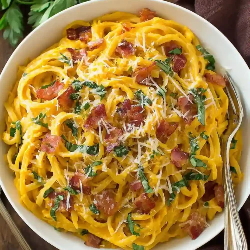 Butternut Squash Pasta Carbonara Recipe 5 Butternut Squash Pasta Carbonara topped with bacon, parmesan, and fresh herbs in a white bowl