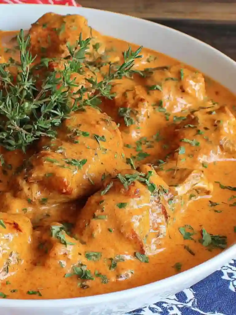 Authentic Chicken Paprikash Recipe 4 Close-up of authentic chicken paprikash in paprika cream sauce with herbs