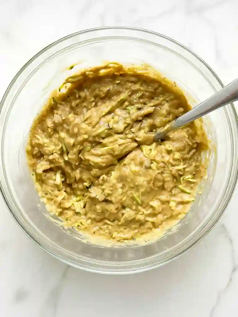 Best Zucchini Bread Recipe 4 Glass bowl of thick mixed batter for Zucchini Bread Recipe with grated zucchini visible
