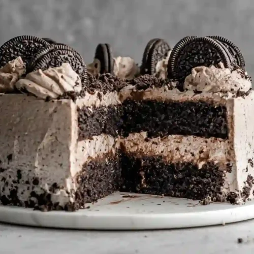 Irresistible Chocolate Oreo Cake Recipe 5 Chocolate Oreo Cake with Oreo frosting and cookies on top