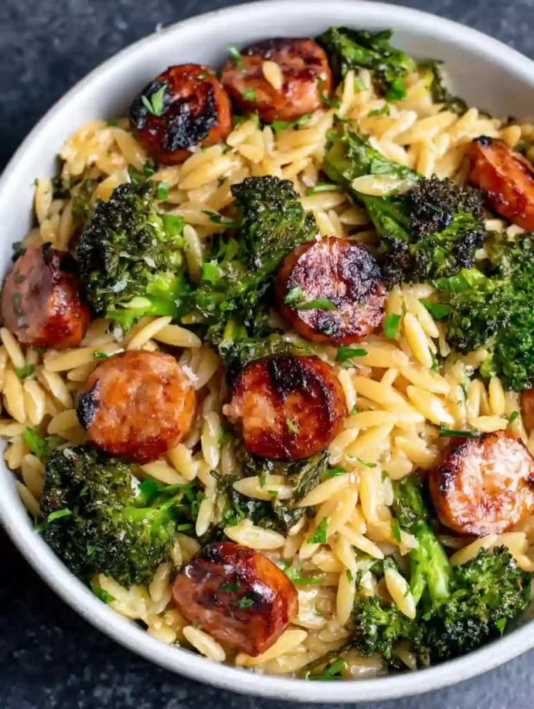 Chicken Sausage and Broccoli Orzo Recipe 3 Overhead view of Chicken Sausage and Broccoli Orzo in a white bowl