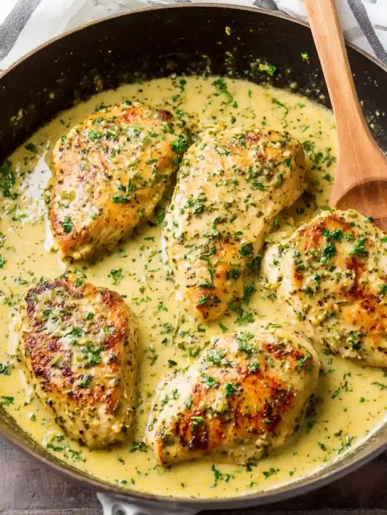 Creamy Pesto Chicken Recipe in 30 Minutes Irresistible 2 Creamy Pesto Chicken simmered in basil cream sauce in a skillet