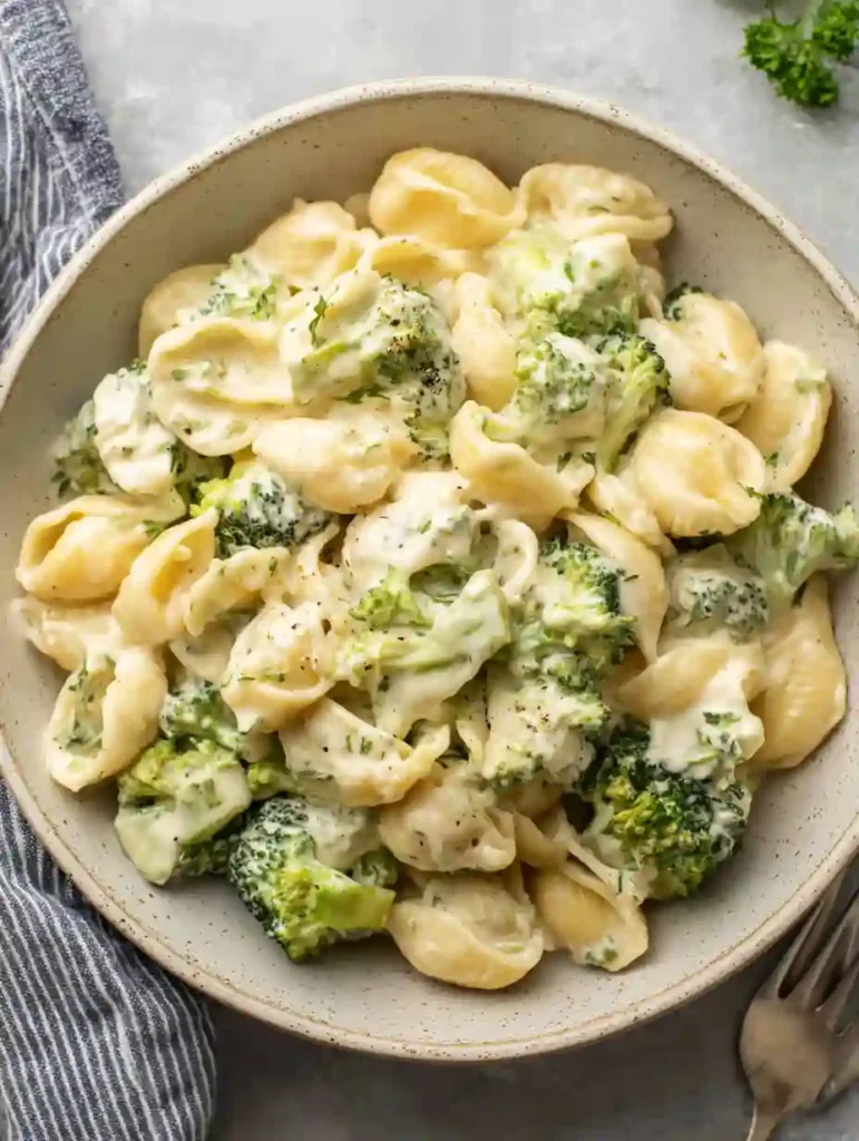 Creamy Broccoli Pasta served in a ceramic bowl with garlic Parmesan sauce