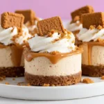 Mini Biscoff Cheesecakes Recipe 10 Close-up of mini Biscoff cheesecakes with whipped cream and cookie topping