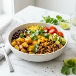 Loaded Potato Taco Bowl with crispy roasted potatoes, beans, avocado and cheese