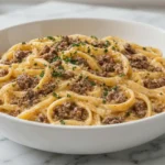 One-Pot Creamy Beef and Garlic Butter Pasta in a white bowl with parmesan sauce and ground beef