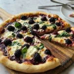 Blackberry Basil Ricotta Pizza with fresh basil, ricotta cheese, and blackberries on a golden crust