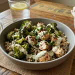 Grilled Chicken Broccoli Bowls with Creamy Garlic Sauce served over rice with roasted broccoli and herbs